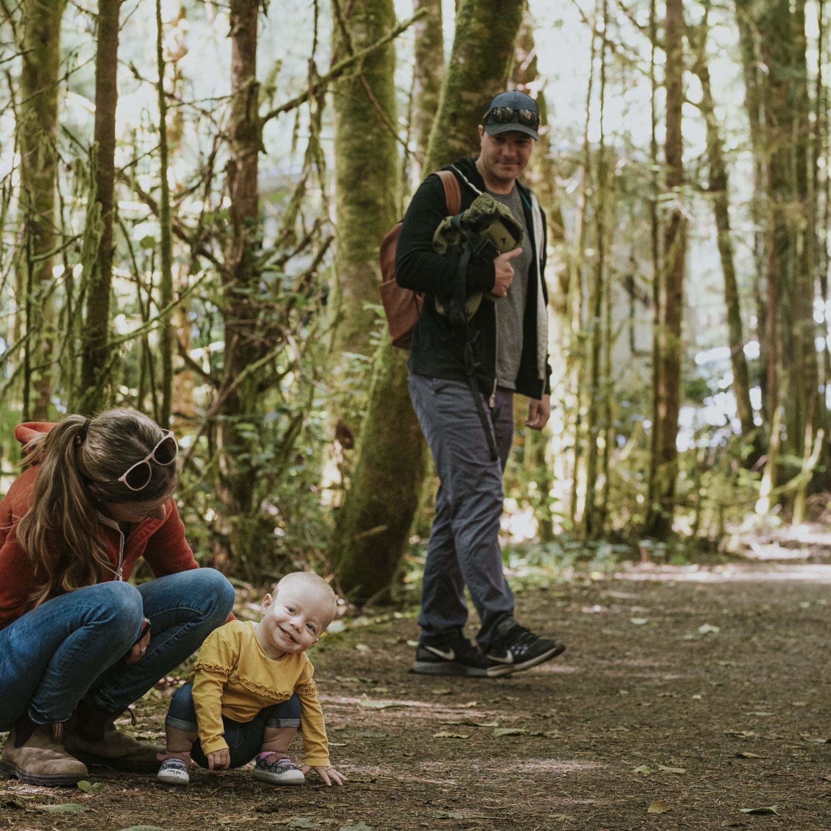 family in a forest in Tofino B.C.